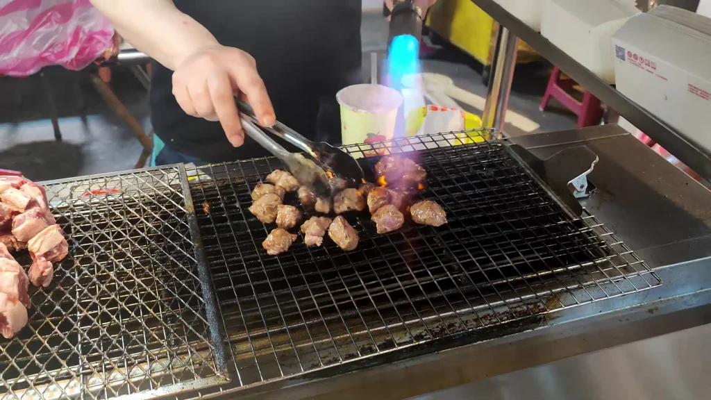 Steak at a Night Market in Taiwan grilled with a blow torch