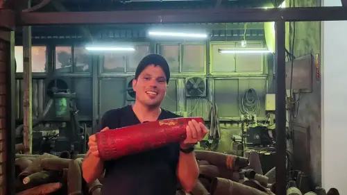 Ferdinand holding an artillery shell used for Kinmen Knives